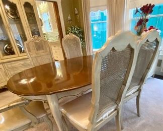 French Provincial dining table with 8 chairs,  plus two leaves. Excellent condition. Comes with custom table top pads