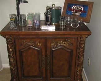 Bar with wine rack and glass holders inside
