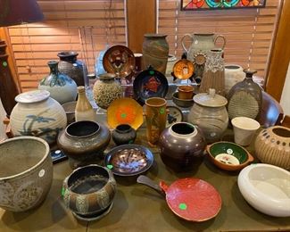 An array of pottery - much of it signed.