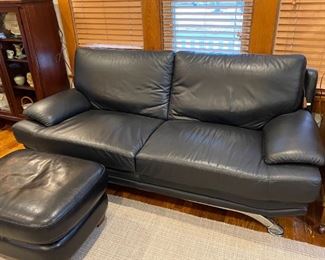 Black leather 2 cushion divan and ottoman