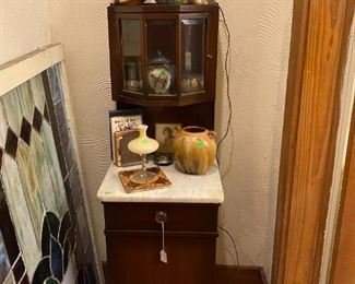 Interesting little cabinet with tri-cornered beveled glass display area and marble top.