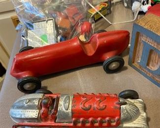 A pair of vintage toy race cars.