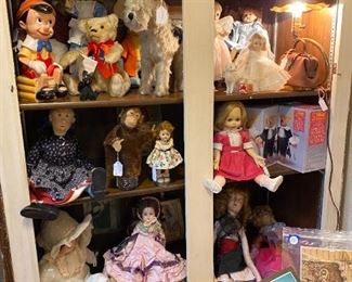 Cabinet full of vintage toys and dolls - some Steiff