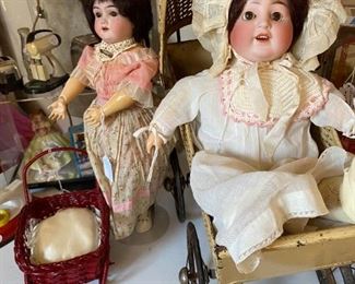 Nice vintage doll buggy and K & K German bisque doll.