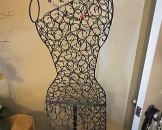 Dress form doubles as a jewelry display for all your earrings and necklaces!