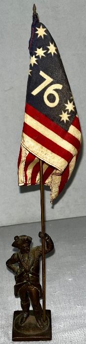 SMALL BRONZE MILITARY FIGURE HOLDING FLAG 