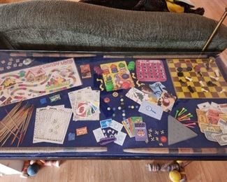 Custom made table featuring vintage children's games and croquet legs