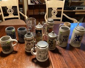 An array of beautiful authentic antique steins, some newer ones too