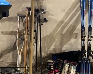 2 sets of snow skis: Pilot Scream by Solomon and Atomic, Pair of women's and men's ski boots, crutches for apres ski, car top ski carrier