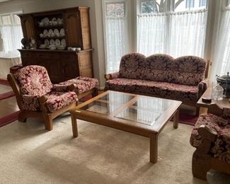 German made "craftsman" style living room set, oak with loose cushions. 3 seat sofa, ottoman, 2 side arm chairs and two large square side tables.