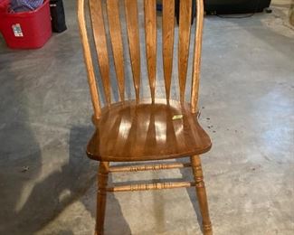 One of three Windsor arrow back oak chairs