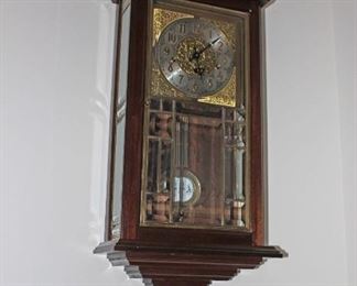 R A Wall Clock with Beverled Glass