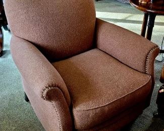 One of a pair of cream colored club chairs
