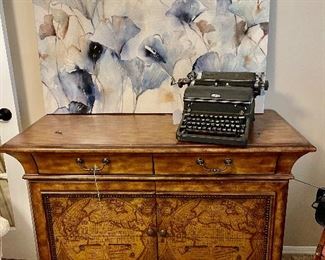 Cabinet with map on front 
Antique typewriter 