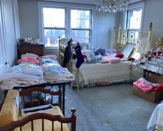 Vintage clothing room and brass queen bed
