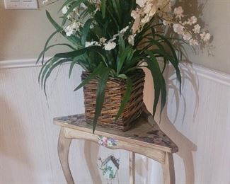 Corner table and a nice artificial flower arrangement