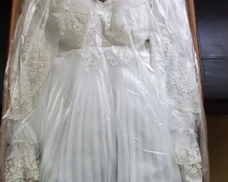 Beautiful wedding dress with pleated overlay skirting