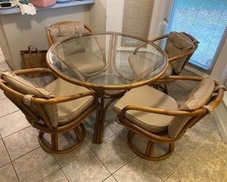 Vintage Rattan Dining Table & chairs
Great condition except for 1 missing button on cushion. 
Table measures: 44” across x 28” tall
Chairs measure: 22” across x 20” deep x 18” tall to seat, 30” tall to back
Must be able to move and load yourself.
