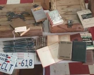 old wooden boxes / crates, license plates, books. 