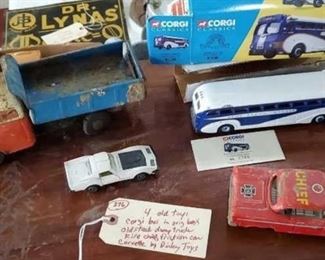 old toy vehicles, Fire chief Edsel, pressed steel dump truck, Corgi bus, white Dinky corvette