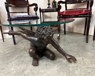 Incredible bronze cherub coffee table with glass top!
