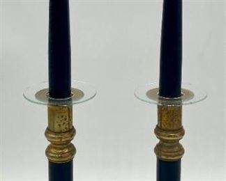 Brass candleholders with black accents