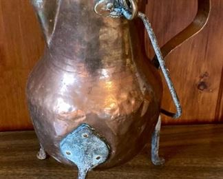 Antique copper footed water pitcher