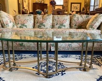 Vintage Tomlinson floral sofa and vintage brass bamboo frame glass top oval coffee table