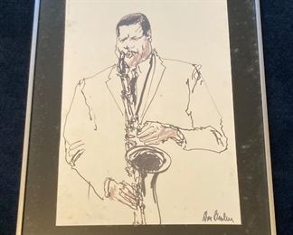 Framed, signed ink drawing of sax player
