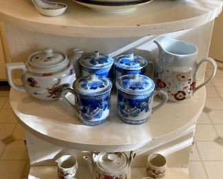 Vintage butterfly and floral lidded teacups; vintage blue and white with large flowers teacups and saucers; vintage blue, red and gold floral teapots with cups