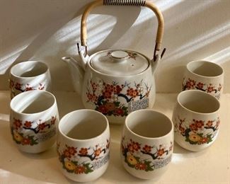 Vintage blue, red and gold floral teapots with cups