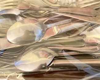 Assorted flatware uncluding International Silver Co., Northland stainless, Excel stainless, Riviera, Wesley Forge stainlessSpirit of America stainless, Towle stainless