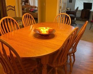 Dining table with 5 leaves and drop leaf on both ends.