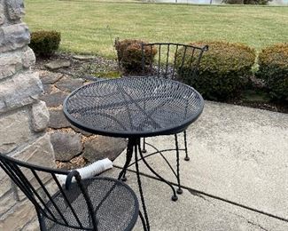 Wrought iron outdoor table and chairs.