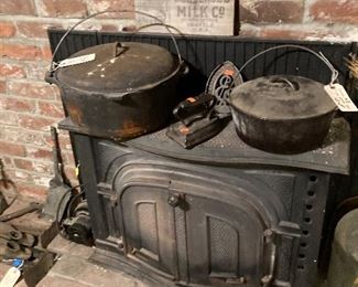huge dutch ovens--one with the trivet