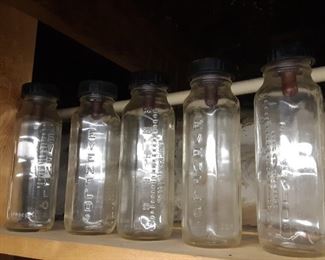 Glass baby bottles, basement 