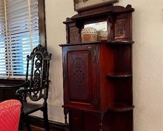 Music cabinet with intricate carvings
