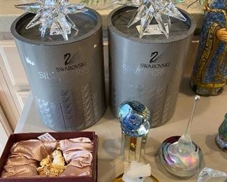 Swarovski crystal star candleholders with boxes; elegant perfume bottles.