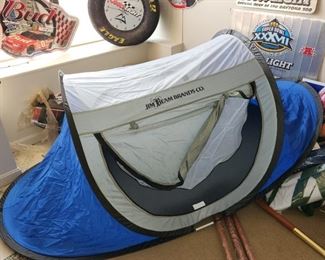 Jim Beam collapsible tent, folds flat into carrying bag (next pic). Perfect for the beach