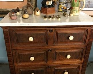 Nice little walnut chest with marble top.