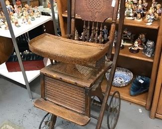 Love this early 1900's high chair that makes easily into a stroller.  Wonderful wheels.  In excellent condition.