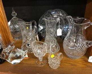 Love these Crystal Pitchers of all sizes with a solid glass bunny hiding among the pitchers.