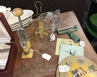 Look closely at vintage primitive nut cracker and napkin holder, chees slicer and timers.