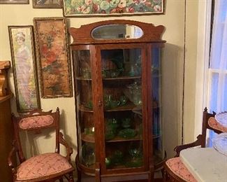 Antique curved glass China cabinet with mirror, green depression glass, antique needlepoint chairs (set of 4)