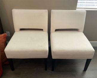 Two white dining chairs, six altogether