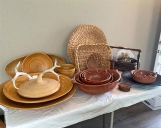 Decor pieces include bamboo, pottery, baskets, antlers