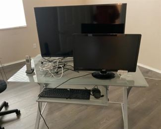 Glass desk, computer monitors 