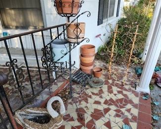 Pebble swan, wrought iron plant stands and more