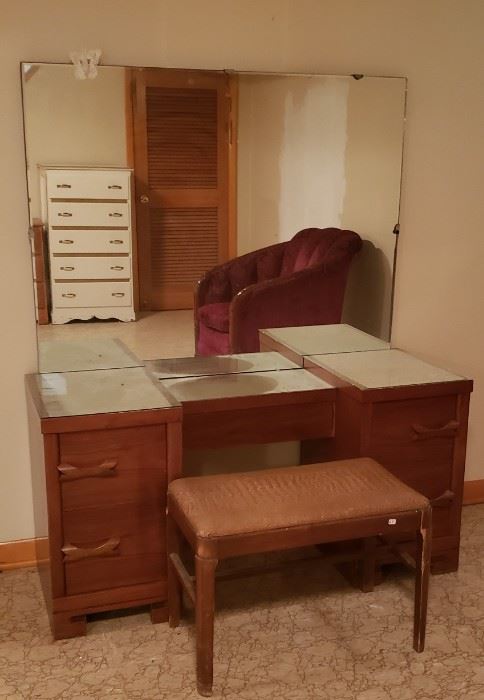 MCM Mid Century Vanity with Mirror & Stool Measures Approx: 49.5"W x 18"D(on ends) x 25"H Mirror is 34.25"H Chair 24"W x 14.5"D x 
$695