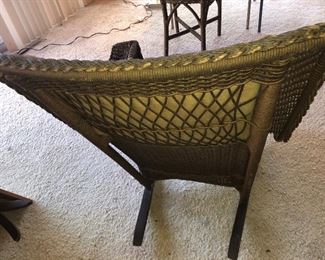 Back View Of Thickness Of The Back Quality Ornate Wicker Antique Rocker With Original Upholstery From The Family Boathouse Circa 1929-1931.THE BEMIS RIDDELL FIBRE CO. IN SHEBOYGAN, WIS., WAS COMMISSIONED IN 1929-1931 TO MANUFACTURE THE FAMILY WICKER COLLECTION OF FURNITURE - RARE ORIGINAL UPOLSTERY IN TAPESTRY DESIGNS